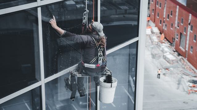 man cleaning window